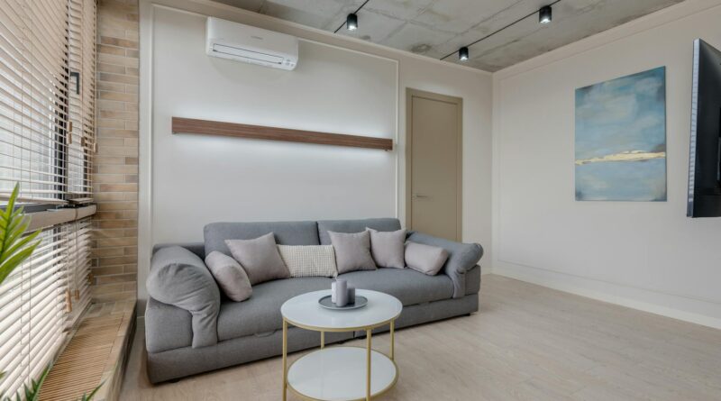 A modern smart thermostat on a wall in a clean apartment