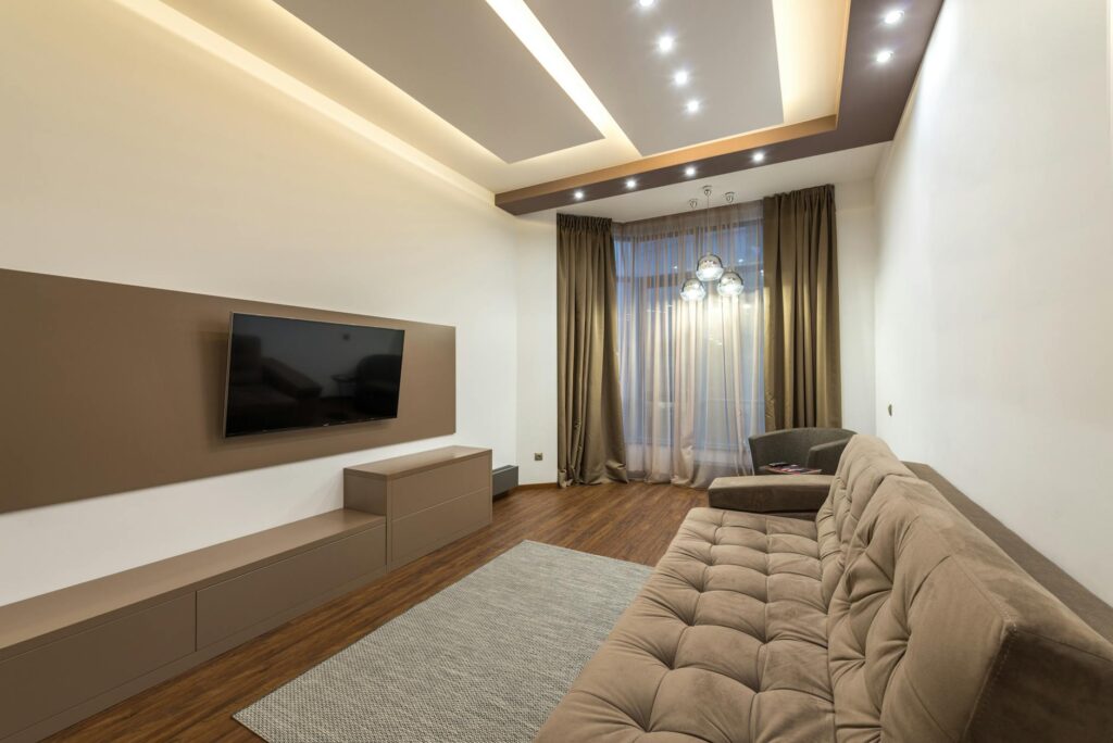 A warm, minimalist living room at dusk with ambient lighting and no visible technology.