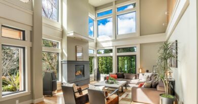 A beautifully lit modern living room with large windows and minimalist decor