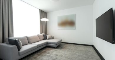 A clean, minimalist living room with hidden technology