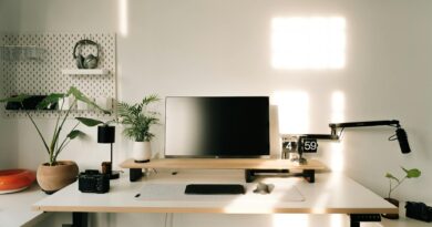 A clean, minimal home office with natural light and an uncluttered desk