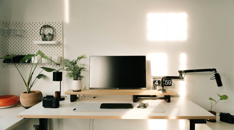 A clean, minimal home office with natural light and an uncluttered desk