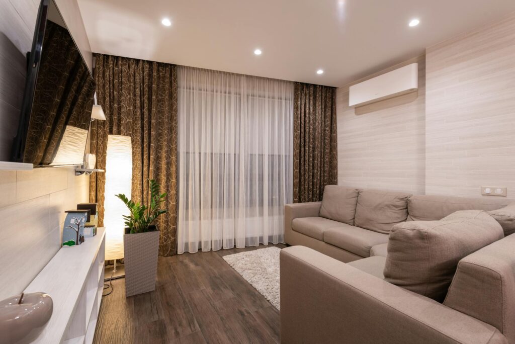 A sleek modern living room with invisible smart home presence detection