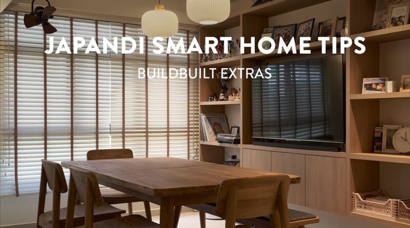 A beautifully designed Japandi living room with warm oak flooring, minimalist furniture, and soft ambient lighting.
